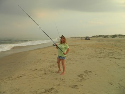New to Ocracoke Current, lady fisher Megan Spencer Shaw has utilized the recent sunny days to hit the beach and practice casting to get ready for a big bluefish fight.